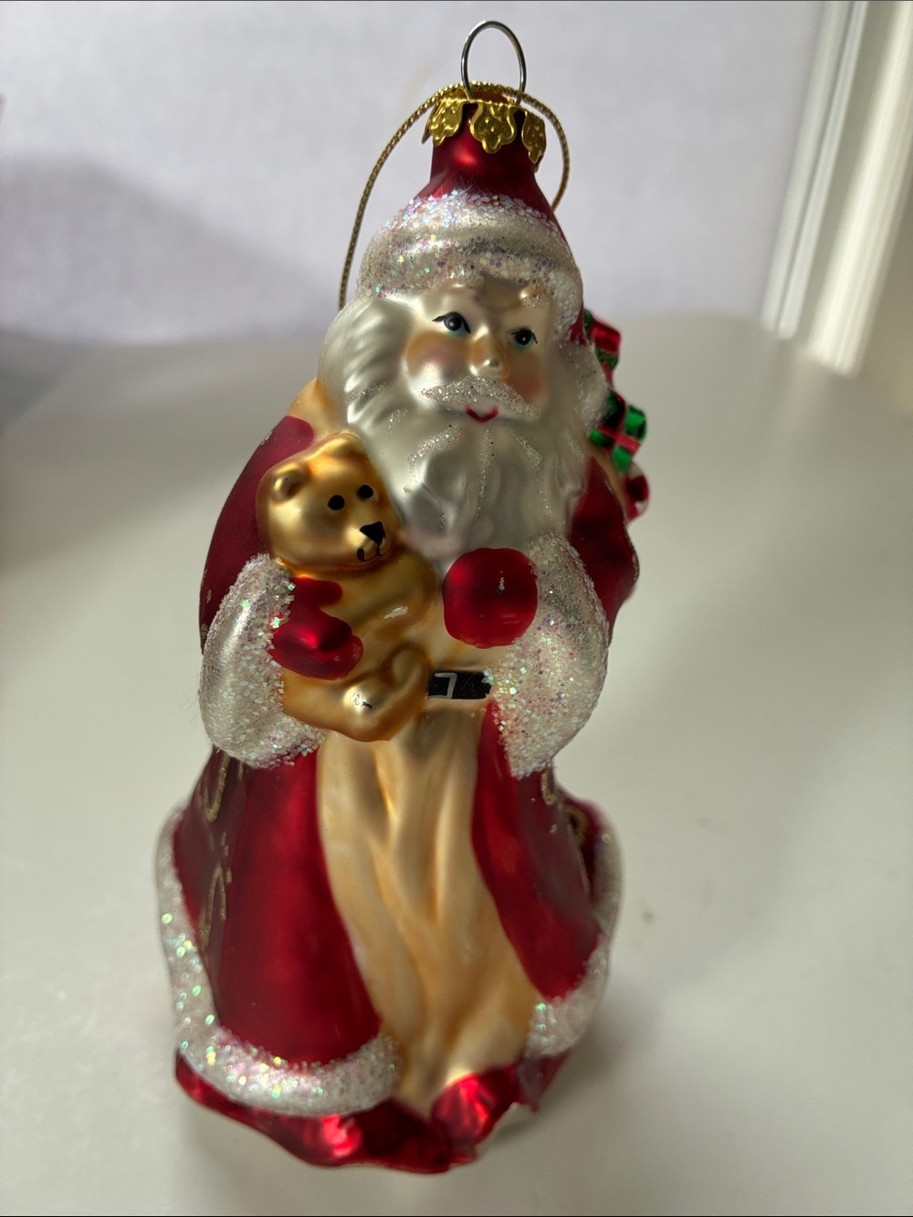 PartyLite 2002 Pearlized Glass Santa Ornament with Red Trim and Gold Logo